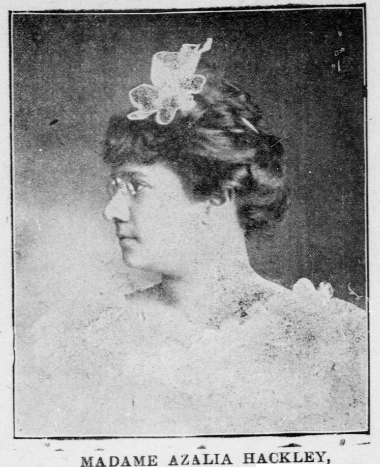 Azalia Smith Hackley face left in a fancy white dress, hair in a bun, white piece on top.