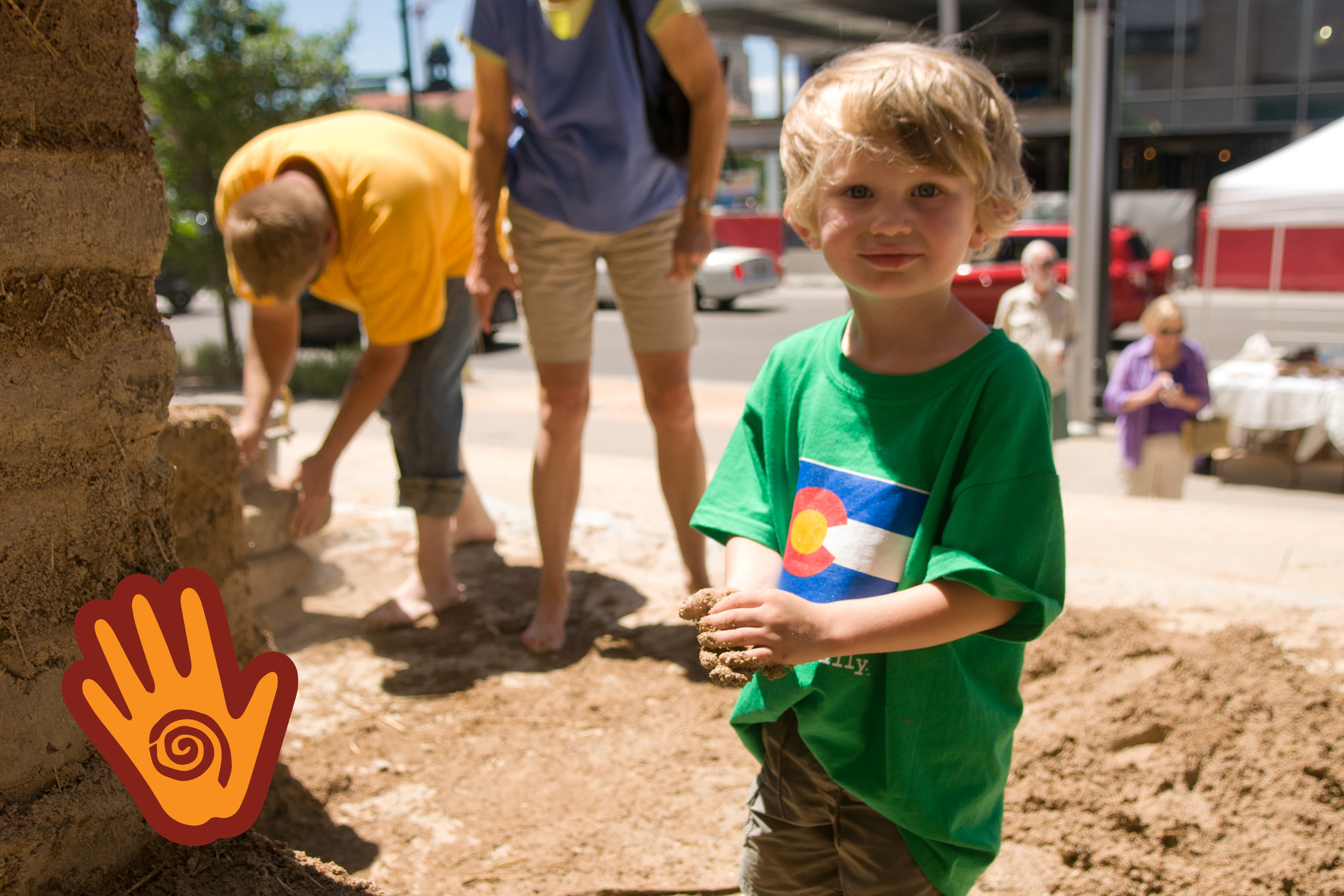 kid making adobe brick