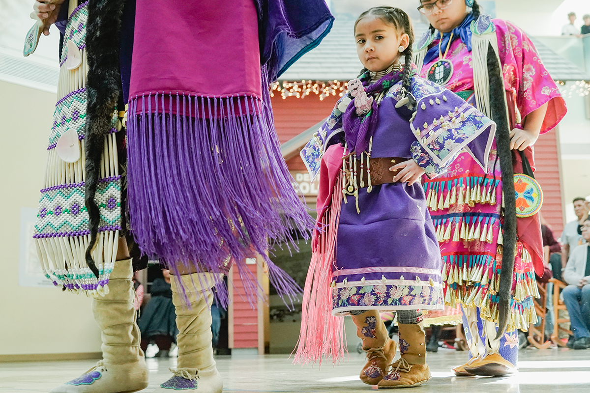 Young Ute Indian girl dancing 