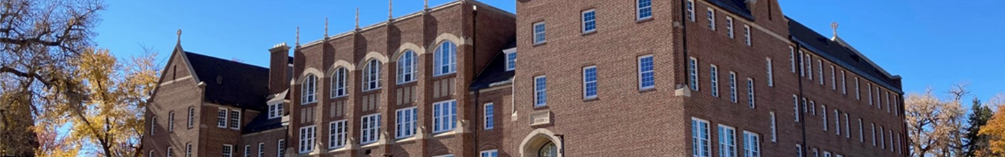 Exterior of Loretto Heights, an ornate brick school building transformed into housing.