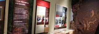 Panels at the main exhibit at the Ute Indian Museum. the panels depict color photos of modern Ute people, and one proclaims that Local History is Ute History.