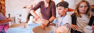 Hands-On History students and teacher making tortillas in a large bowl