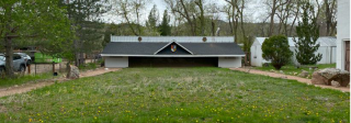A long horizontal building that is used as a Japanese archery range