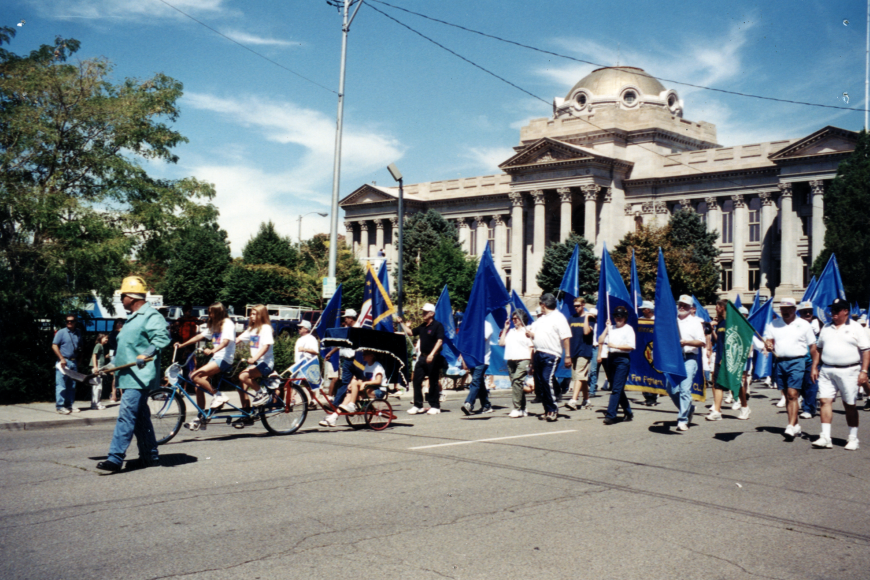 A group of protestors marching out in front of the Pueblo County Courthouse.