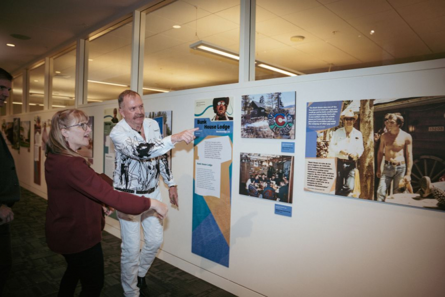Visitors pointing at the Bunk House Lodge section of the Keeping Place exhibit at the museum