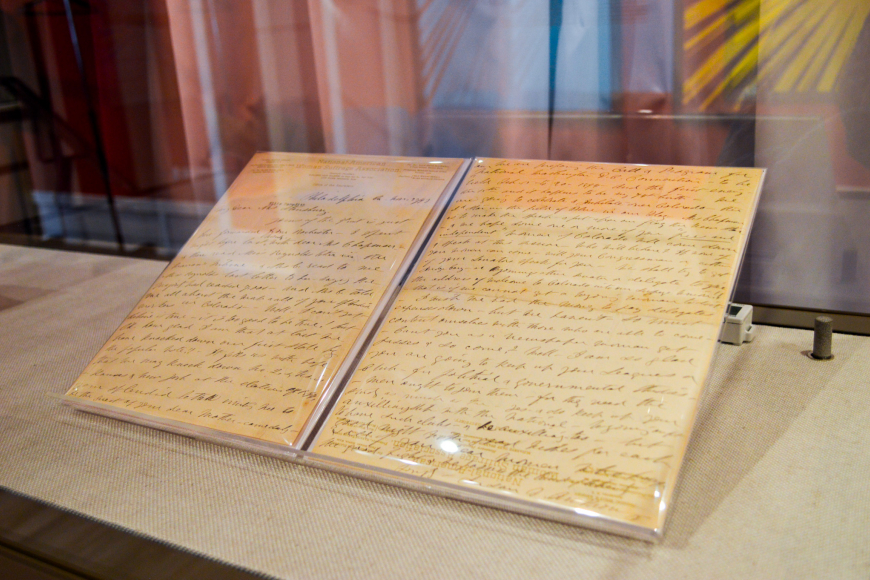 2 large pieces of paper with covered in cursive script.