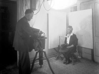 Photo of Woman sitting for mugshot for violating Prohibition laws in Denver, 1920s