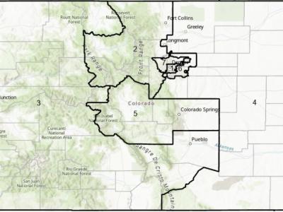 Image of the state of Colorado with the districts outlined & named as they were in 2013. There are 7 districts: 1) the city of Denver, 2) a sizeable area to the north & west of Denver, 3) nearly half of the state to the west, extending along half of the southern border, 4) the eastern half of the state, 5) an odd-shaped area in the middle of the state, 6) a very asymmetrical area circling the eastern half of Denver, and 7) an uneven area north & east of Denver.