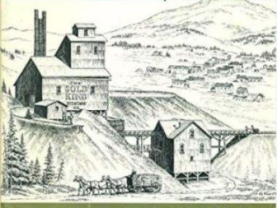 Image of book cover, Pikes Peak Gold: A Photographic Account of the Cripple Creek and Victor Mining District by Fred Mazzulla, Jo Mazzulla, and Henry L J Warren. The cover design is divided into three sections: the top quarter of the cover has decorative large lettering that says "Pikes Peak GOLD", printed in black ink with golden highlights, on a blue background. The center image is an illustration of a mining operation on a hillside. The bottom of the cover is green, printed with the rest of the title.