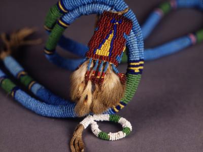 Blue and green beaded necklace with red beaded decoration with fur