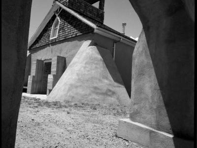 A view of Capilla de San Acacio, a small chapel building made of adobe.