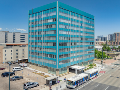 Exterior of 655 Broadway, the turquoise multistoried offices in Denver.