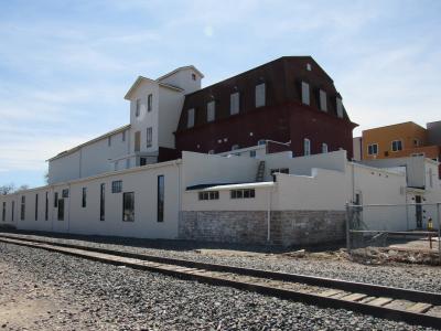Exterior of Loveland Feed and Grain with restored windows and new paint.
