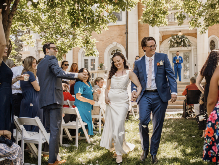 Bride and groom walking down the aisle at outdoor wedding at Grant-Humphreys Mansion