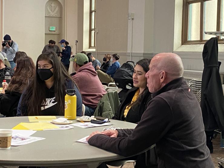 5 people at a community gathering for memories of displaced aurarians.