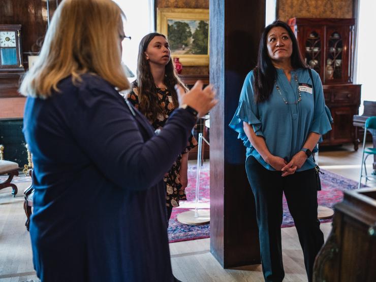 Tour given to two visitors in the library at the center for Colorado women's history.