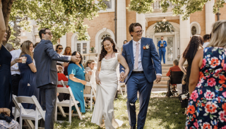 Bride and groom walking down the aisle after an outdoor wedding at the Grant-Humphreys Mansion