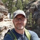 Chris Bowles with an outdoor backdrop